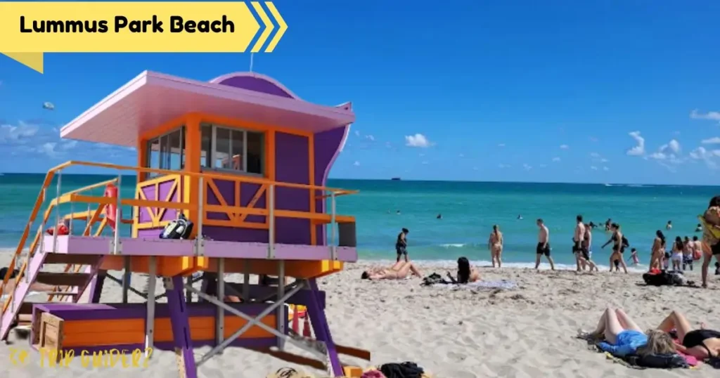 A colorful purple and orange lifeguard stand on the iconic Lummus Park Beach, a popular and vibrant beach in Miami
