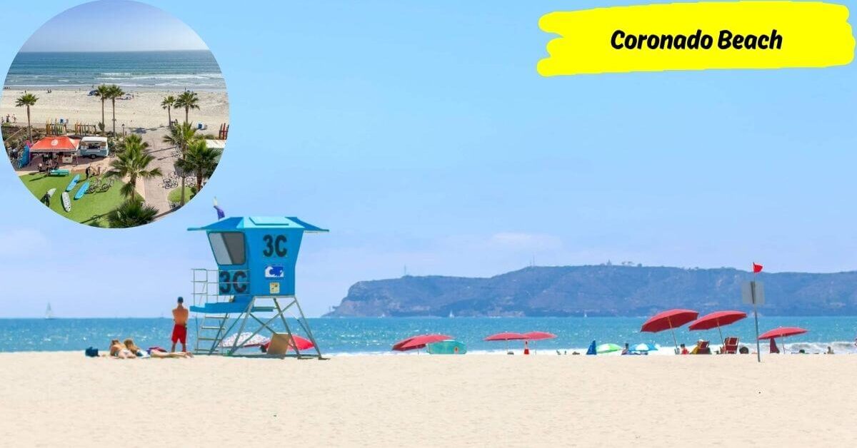 A bright image of Coronado Beach with a blue lifeguard tower, red umbrellas, people enjoying the sand and waves, and the skyline of San Diego in the distance.