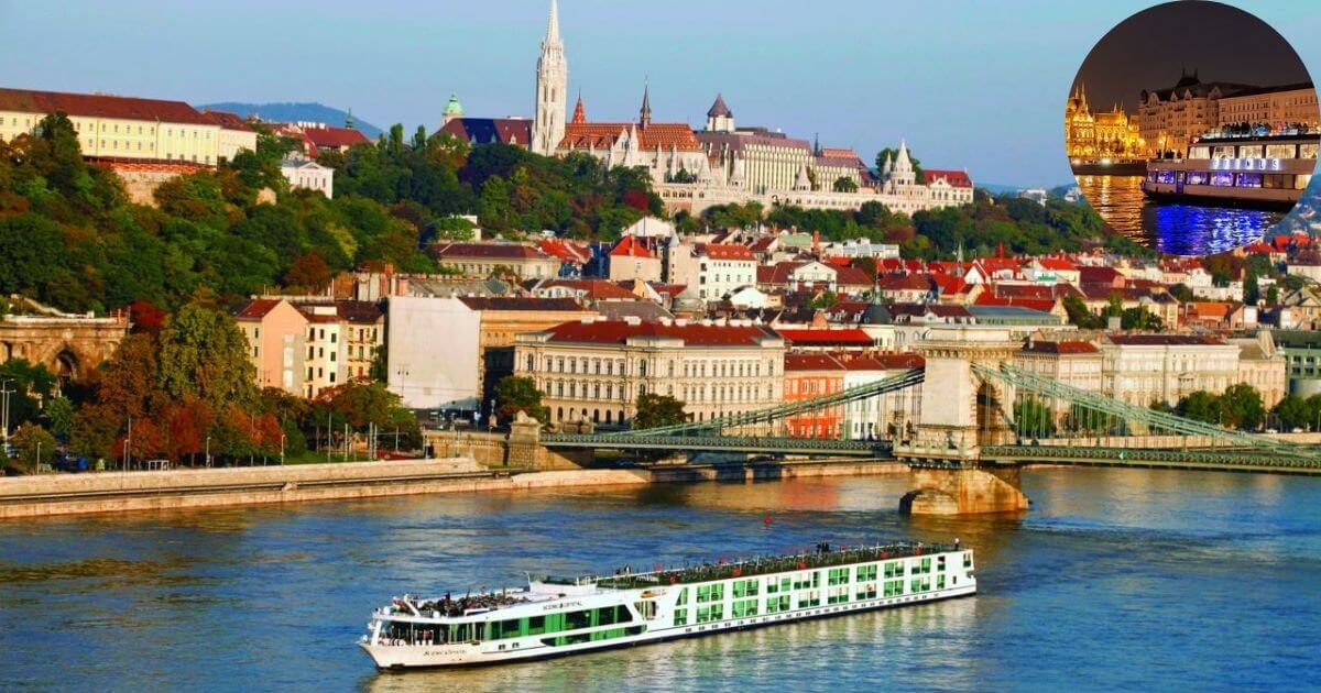 A double-decker boat cruise on the Danube River at dusk in Budapest, with the city lights and bridges in the background.