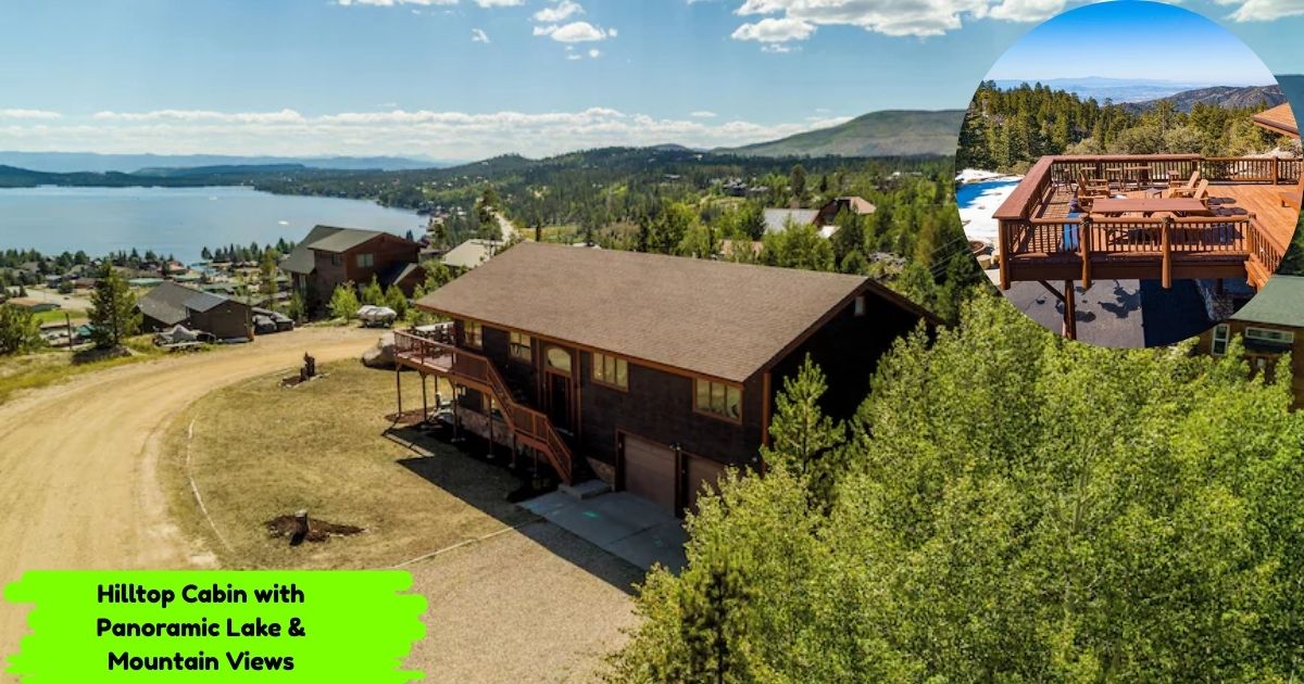 A photo of a large, brown two-story cabin on a hilltop with a stunning panoramic view of a large lake and mountains in the background. An inset photo shows the spacious wooden deck of the cabin, complete with outdoor furniture.