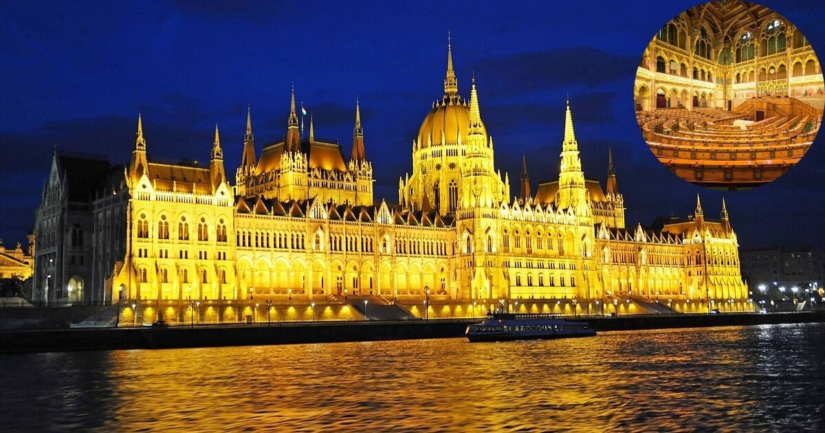 A beautiful view of the Hungarian Parliament Building in Budapest, with its detailed Gothic Revival architecture reflecting on the calm surface of the Danube River.