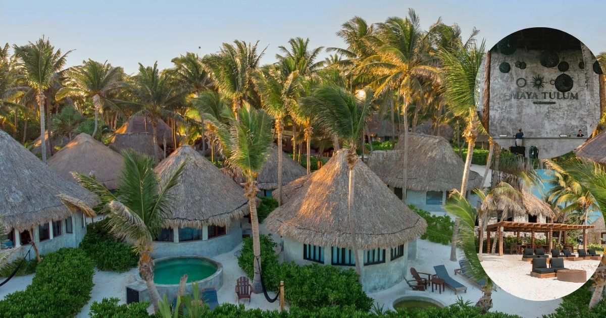 An aerial view of the unique, circular, thatched-roof bungalows at MAYA TULUM HOTEL, situated on a bright white sandy ground with a central swimming pool and lush tropical foliage