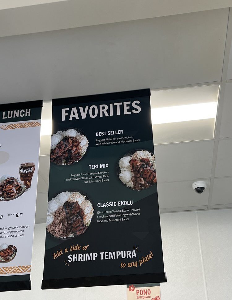 An image of an overhead menu banner at Mo' Bettahs, titled "Favorites," with photos and descriptions of popular combination plates: Best Seller (Teriyaki Chicken), Teri Mix (Teriyaki Chicken and Steak), and Classic Ekolu (Ekolu Plate).