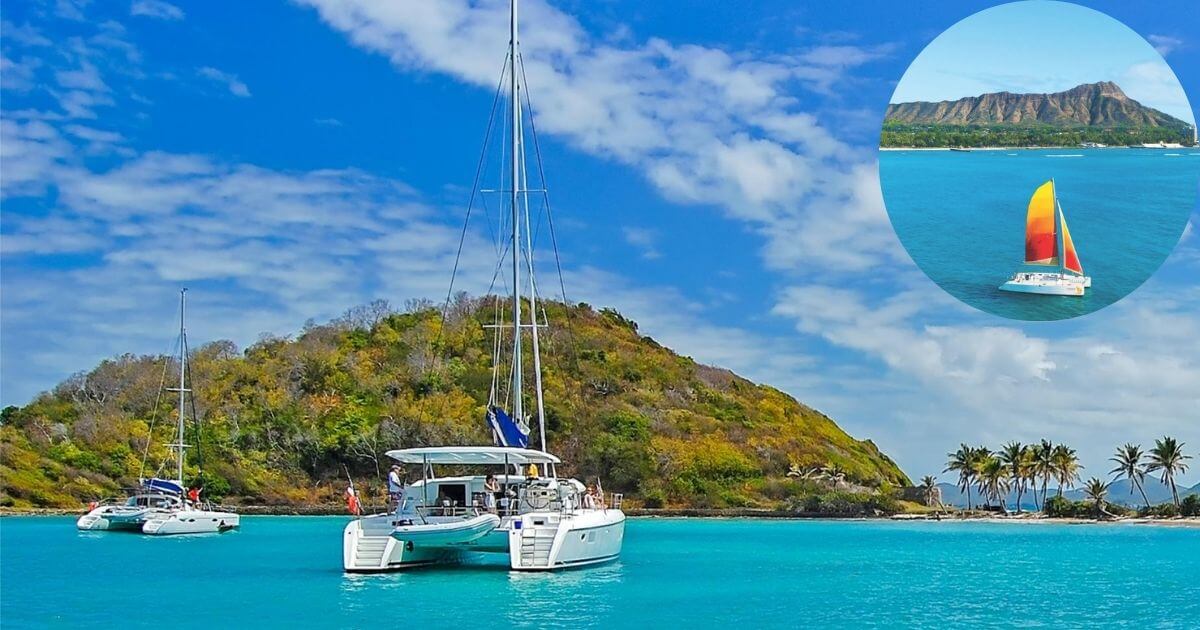 A large white catamaran sailboat in bright blue water near a lush green island with palm trees. An inset shows a different catamaran with a red and yellow sail on the ocean.