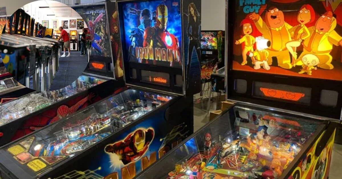 A person playing a vintage pinball machine at the Pinball Hall of Fame in Las Vegas, with rows of colorful, classic pinball machines in the background.