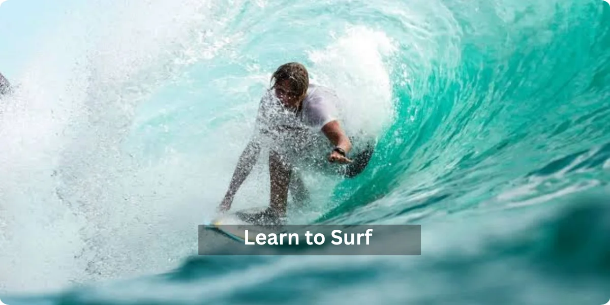 A group of beginners taking a surfing lesson on a beach in the Philippines, with instructors guiding them on the waves.