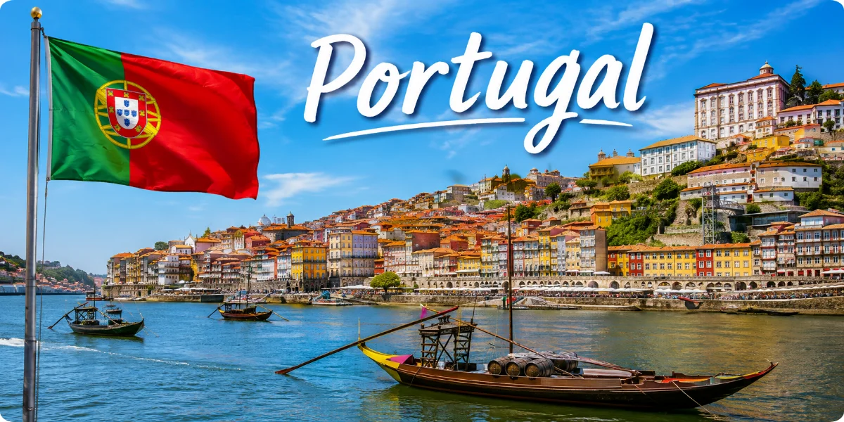 A scenic view of Portugal's coastline, showcasing cliffs, beaches, and the ocean under a clear blue sky.