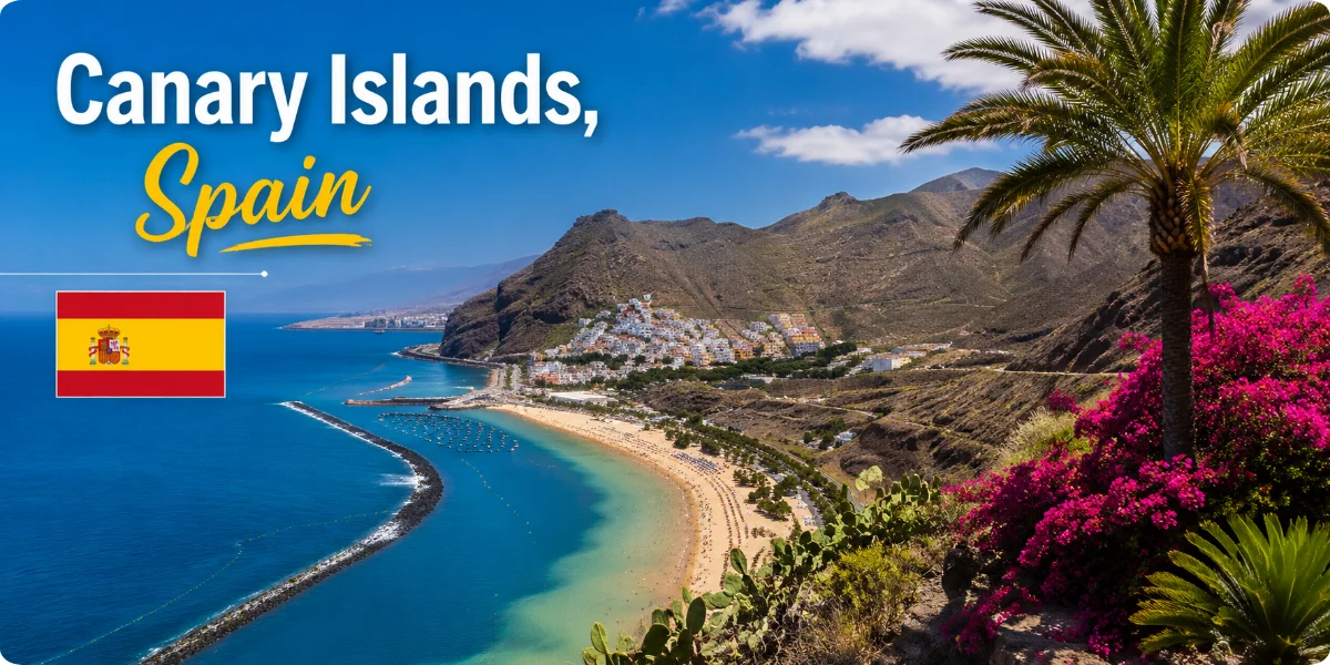 Scenic view of the Canary Islands, showcasing lush landscapes and coastal cliffs under a clear blue sky.