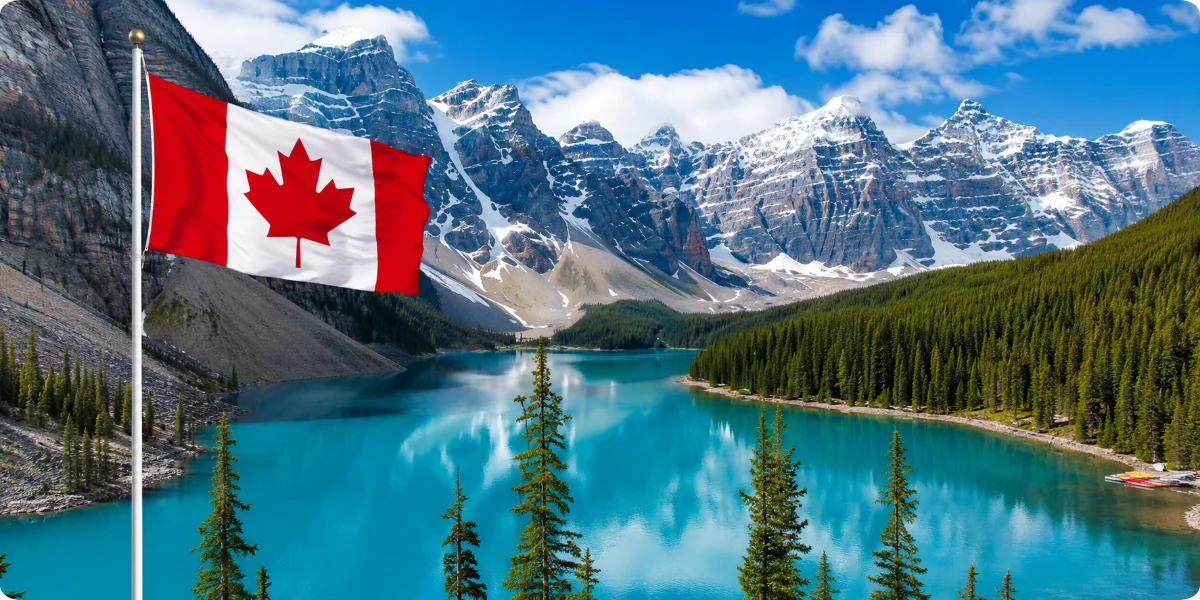 A close-up view of the Canadian flag, displaying its vibrant red and white colors with the prominent maple leaf symbol.