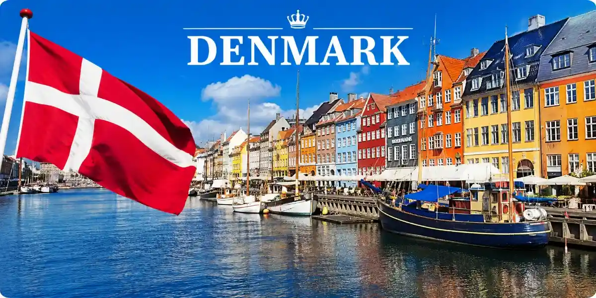 The Danish flag waves above a canal in Copenhagen, showcasing the city's vibrant atmosphere and scenic waterways.