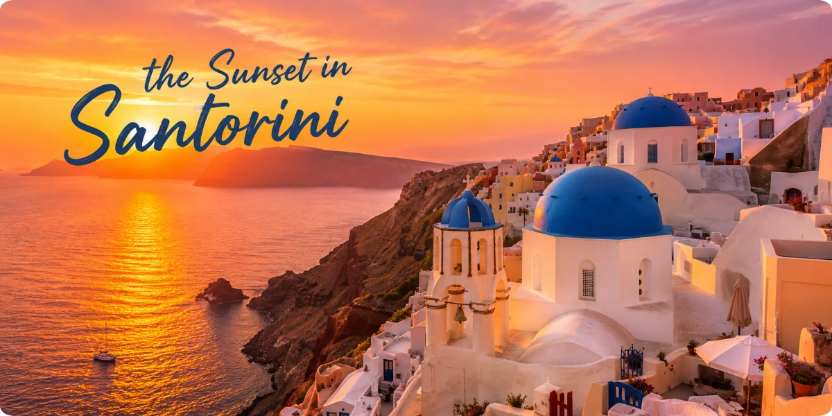 A breathtaking sunset over Santorini, with vibrant orange and pink hues illuminating the sky and reflecting on the sea.
