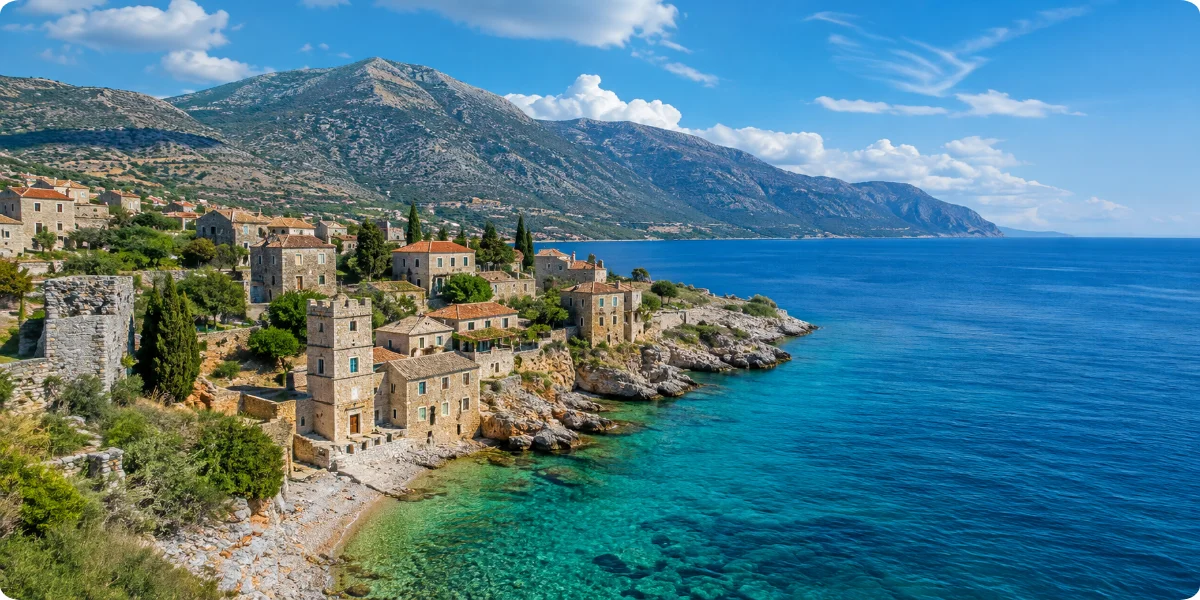 Coastal panorama of Mani Peninsula in Croatia, highlighting the serene waters and dramatic cliffs along the shoreline.
