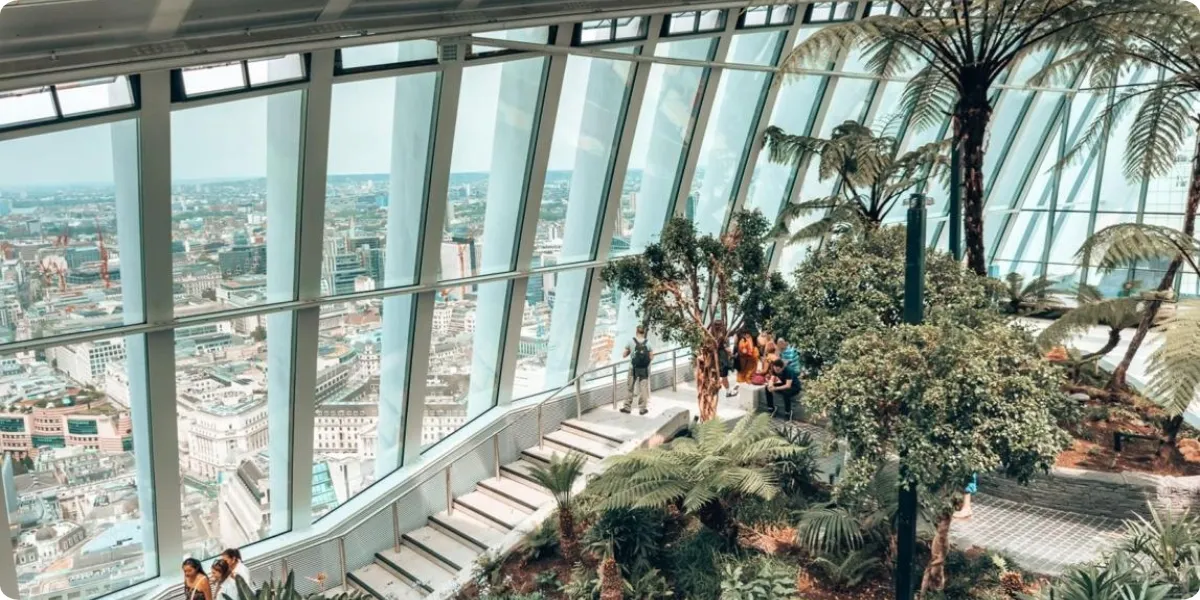 Panoramic London skyline viewed from Sky Garden's indoor gardens