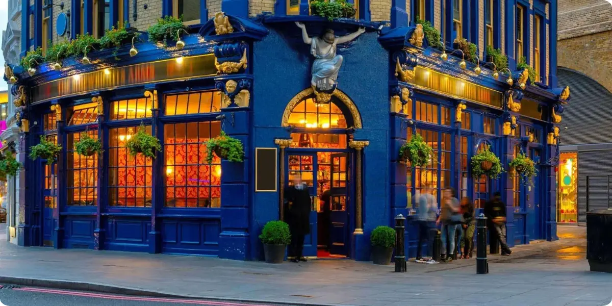 Traditional British pub glowing warmly on a London evening