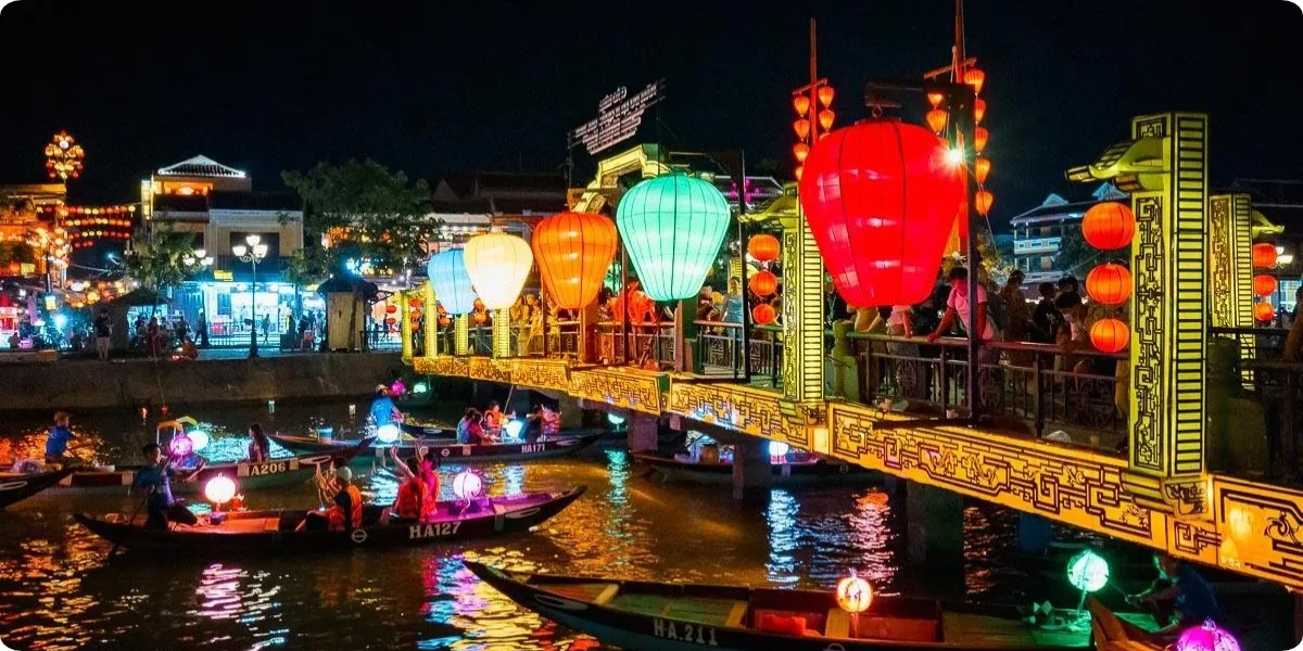 Colorful lanterns illuminate the Thu Bon River in Hoi An at night