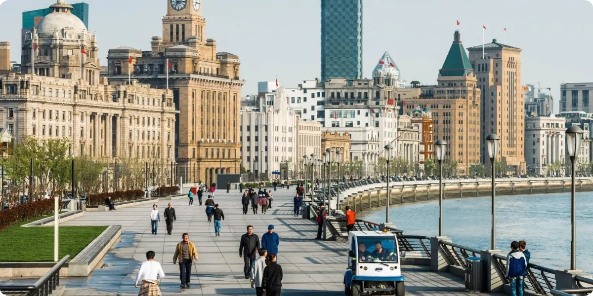 Walking along The Bund waterfront promenade in Shanghai